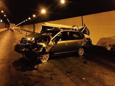 The seriously damaged car and minibus