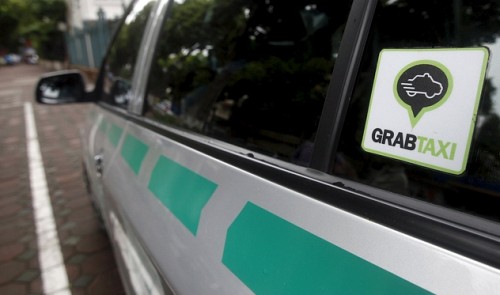 A GrabTaxi logo is seen on a taxi in Ha noi, September 9, 2015. Reuters