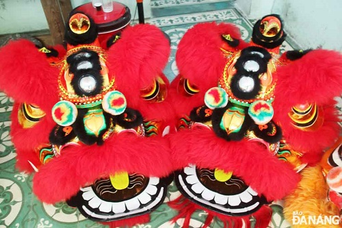     A pair of red lion heads symbolising luck and happiness