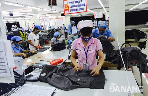 Workers at a local textiles and garments company