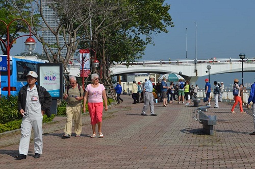 Foreign visitors on the Bach Dang pedestrian promenade