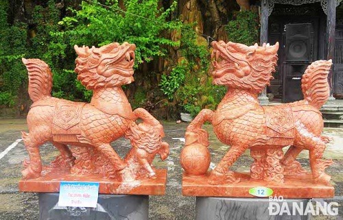  Carvings of 'nghe' on display at the exhibition