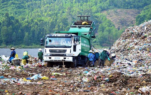 A truck unloading garbage at the waste dump