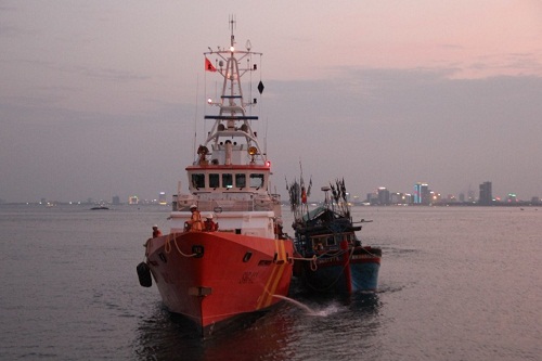 Fishing boat KH 96977 TS (right) being towed by the rescue ship