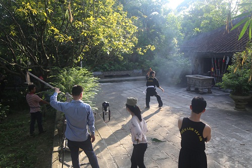 A scene from a VTV documentary on Vietnamese traditional martial arts being filmed at the house