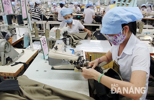 Workers at a local textiles and garments company