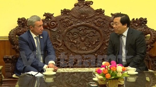 Vietnamese Ambassador Nguyen Thanh Son (R) receives Andrey Klimov