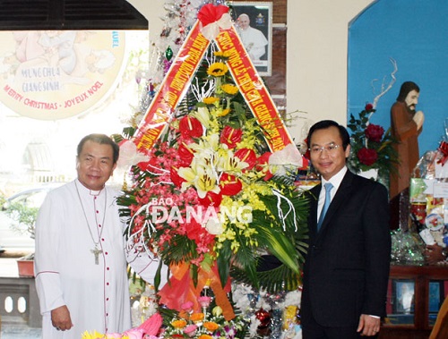 Bishop Chau Ngoc Tri and Secretary Anh (right)