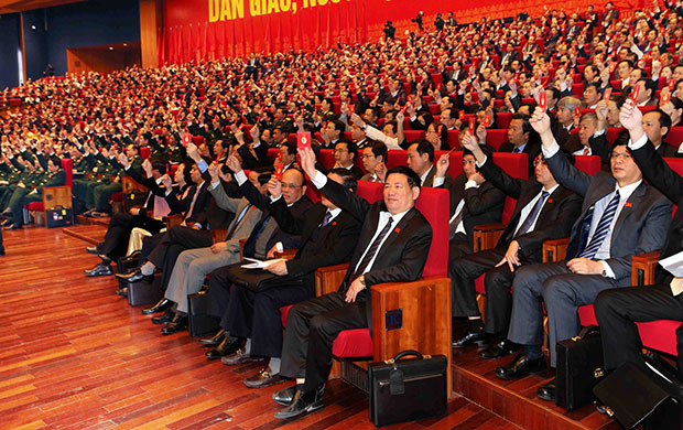 Đại hội đại biểu toàn quốc lần thứ XII Đảng Cộng sản Việt Nam họp phiên trù bị tại Trung tâm Hội nghị quốc gia ở thủ đô Hà Nội. Trong ảnh: Các đại biểu biểu quyết thông qua Chương trình Đại hội. Ảnh: TTXVN