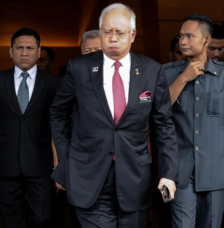 Thủ tướng Najib Razak từng đối mặt với áp lực kêu gọi từ chức. 			                              Ảnh: AFP