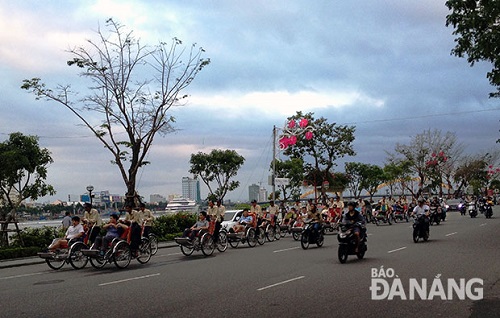 South Korean visitors enjoying a city tour by cyclo