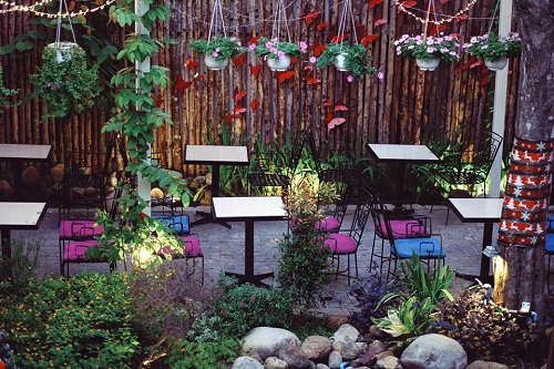 Outdoor area featuring beautiful tables and chairs 