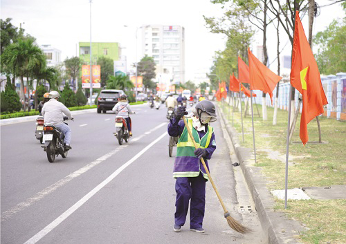   A worker cleaning a street