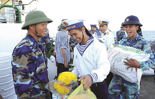  Naval soldiers joyfully receiving Tet gifts