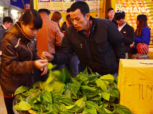   Buying buds at a local pagoda …