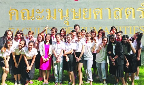 Nguyen Thi Trang (pink skirt) poses together with her students at Srinakharinwirot University in Bangkok, Thailand. By courtesy of Nguyen Thi Tran