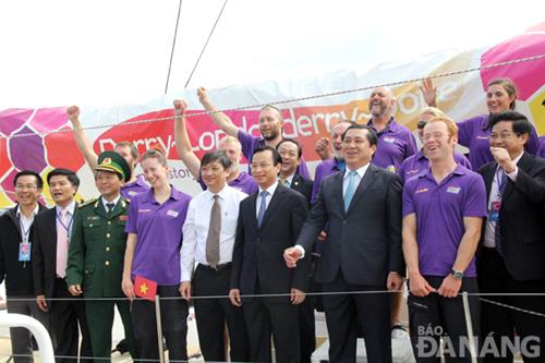   Some of the city’s leaders in a photo with the team