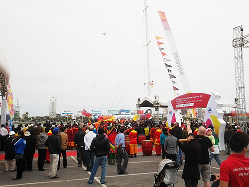 Crowds gather as it moors up