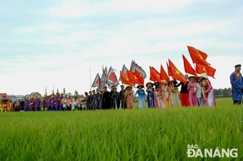 A procession through the green paddy fields to pray for a year of favourable weather and bumper crops