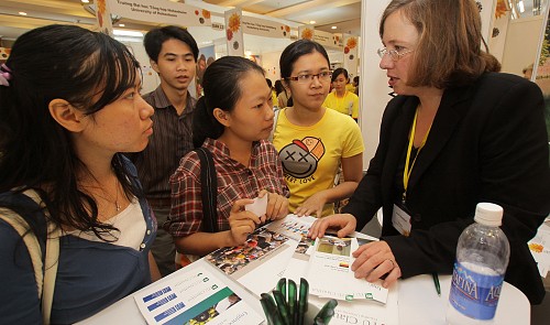 In this file photo, Vietnamese applicants are seen seeking information on study in France and Germany at an education fair in Ho Chi Minh City. Tuoi Tre