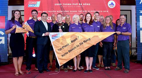  Municipal PC Chairman Huynh Duc Tho presenting a pennant to race winners Derry-Londonderry-Doire …