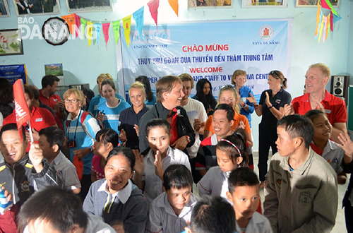 Crew members and AO victims sing together