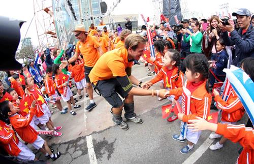    The team’s members shaking hands with lovely local children