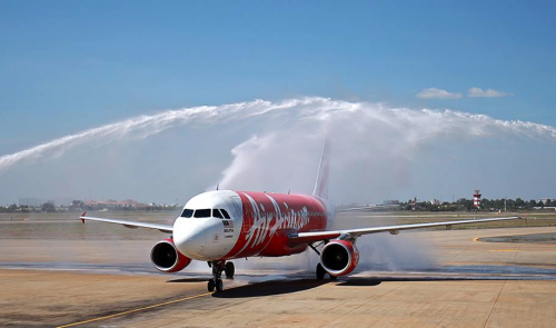 An AirAsia plane is given a water cannon salute when the plane arrives in Ho Chi Minh City from Penang, Malaysia, on January 25, 2016.