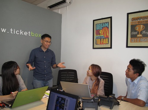 Tran Tuan Anh, founder of Ticketbox, an online ticketing platform backed by 500 Startups, speaks to team members at the company's office.