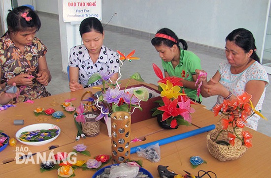  Disabled children on a course for making chiffon flowers at the city’s Support Centre for AO Victims and Disadvantaged Children