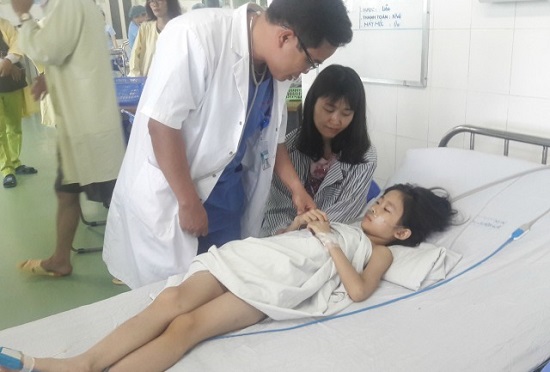 A doctor examining a child survivor at the city’s Maternity and Paediatrics Hospital