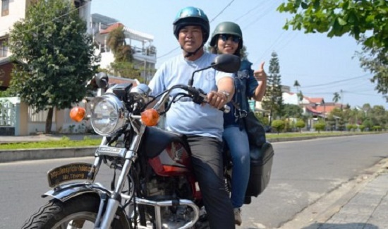 Seasoned ‘easy rider’ Do Van Thong (front) and his client are getting ready for a ride. Tuoi Tre