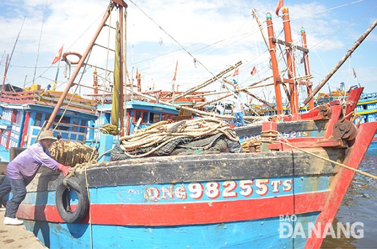 A fisherman making preparations for an offshore trip