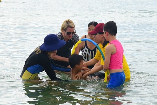  A child being taught how to swim