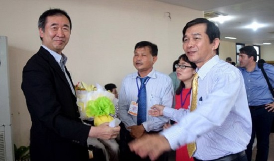 Professor Takaashi Kajita (L) is pictured in Binh Dinh Province on July 10, 2016.