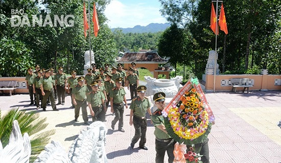 Local police officers laying a wreath at the relic site Zone 5 to pay tribute to fallen heroes and martyrs