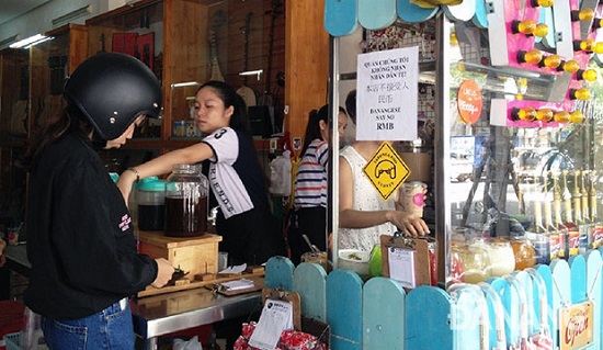 Customers at musician Khoai’s beverage store