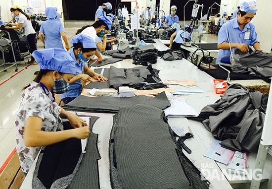 Workers at a local textiles and garments company