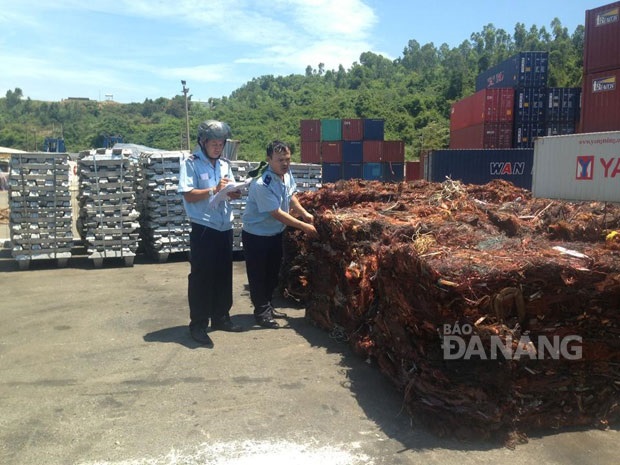  Customs officers checking the seized items