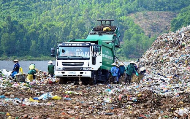  A truck unloading garbage at the waste dump