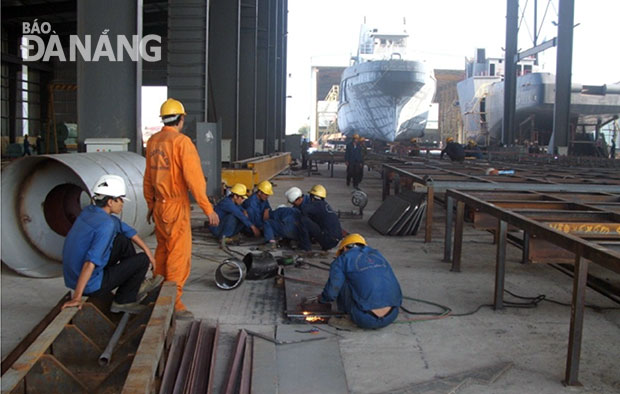Workers at a local shipbuilding company