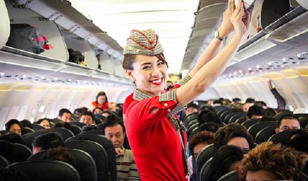 A stewardess poses on a Vietjet aircraft. Vietjet Air