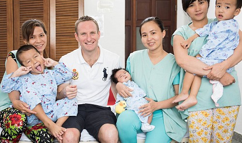 Scott Kirkham with children with congenital heart disease and their mothers in a hospital