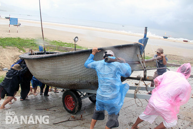 A fishing boat being brought ashore