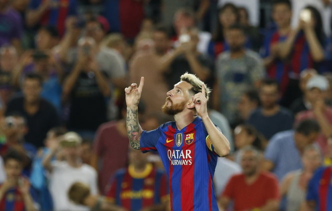 Niềm vui của Messi sau khi ghi bàn cho Barcelona. Ảnh: Reuters