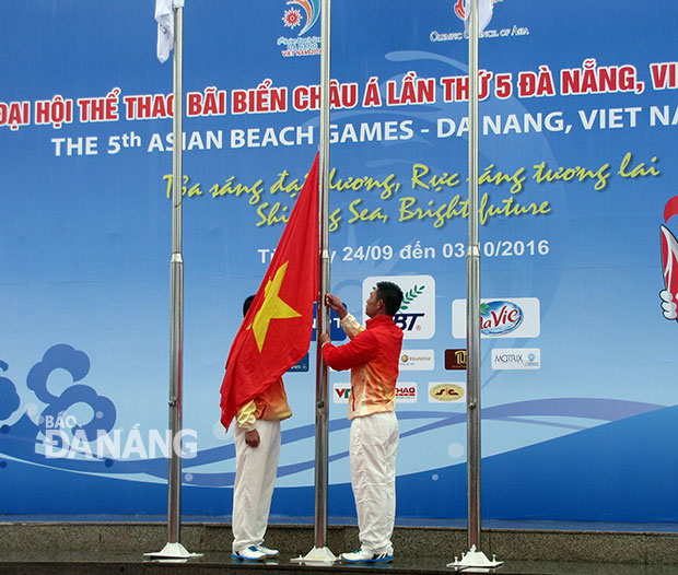 The Vietnamese flag being hoisted at the ceremony