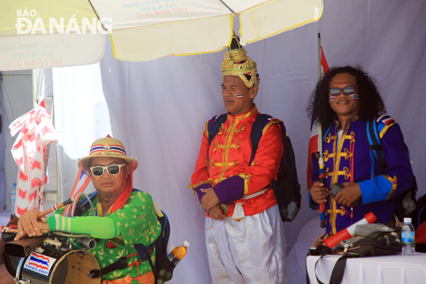 Thai supporters wearing colourful costumes