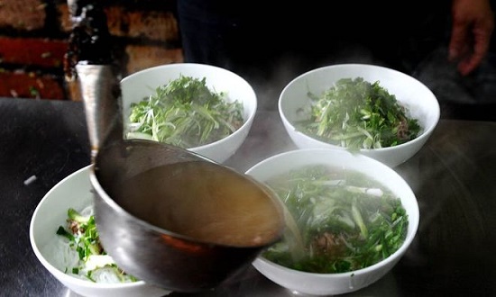 Pho is served at a shop in Hanoi. Photo by AFP/Hoang Dinh Nam