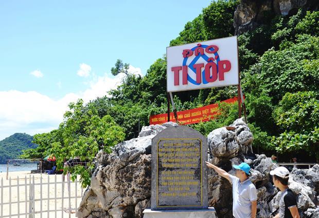  Visitors reading about the island’s name