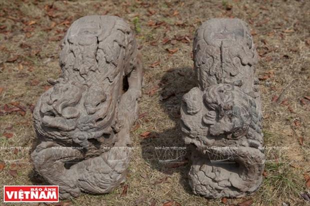 A pair of Nghe animals made of wood 